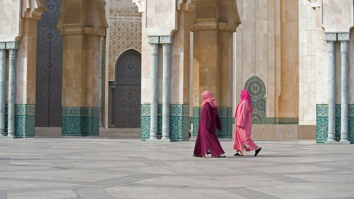Two women walk in Hasan II Mosque in Casablanca, Morocco